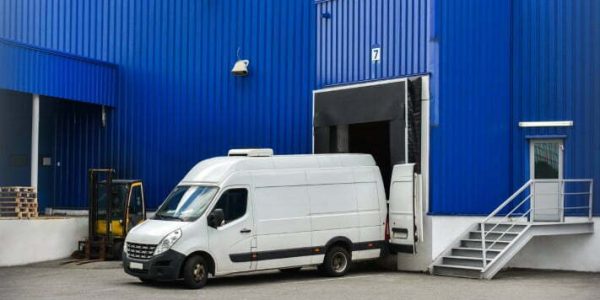 van in loading and unloading commercial cargo in warehouse dock